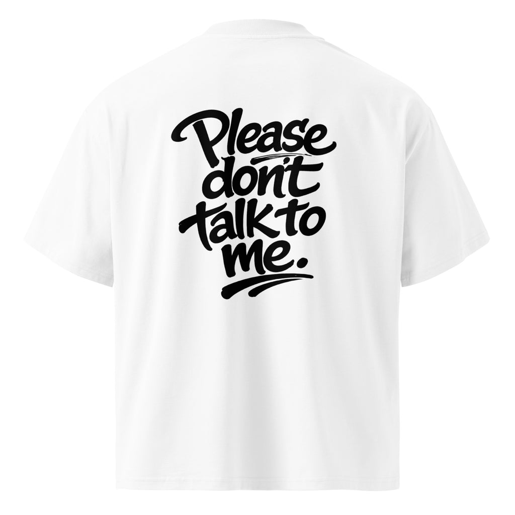 Model wearing a black oversized “Please Don’t Talk To Me” slogan t-shirt with relaxed fit and dropped shoulders, styled for everyday streetwear.