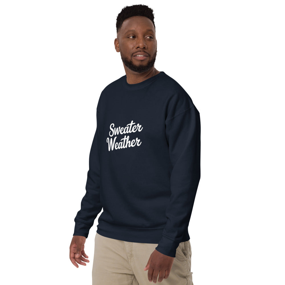 Man wearing a navy blue sweatshirt with 'Sweater Weather' text on a white background