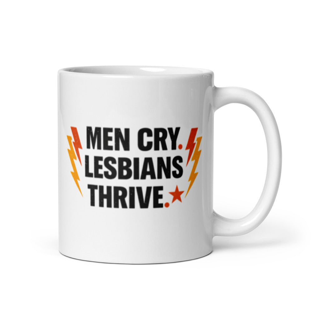 Men Cry, Lesbians Thrive slogan printed on a white ceramic mug with bold typography