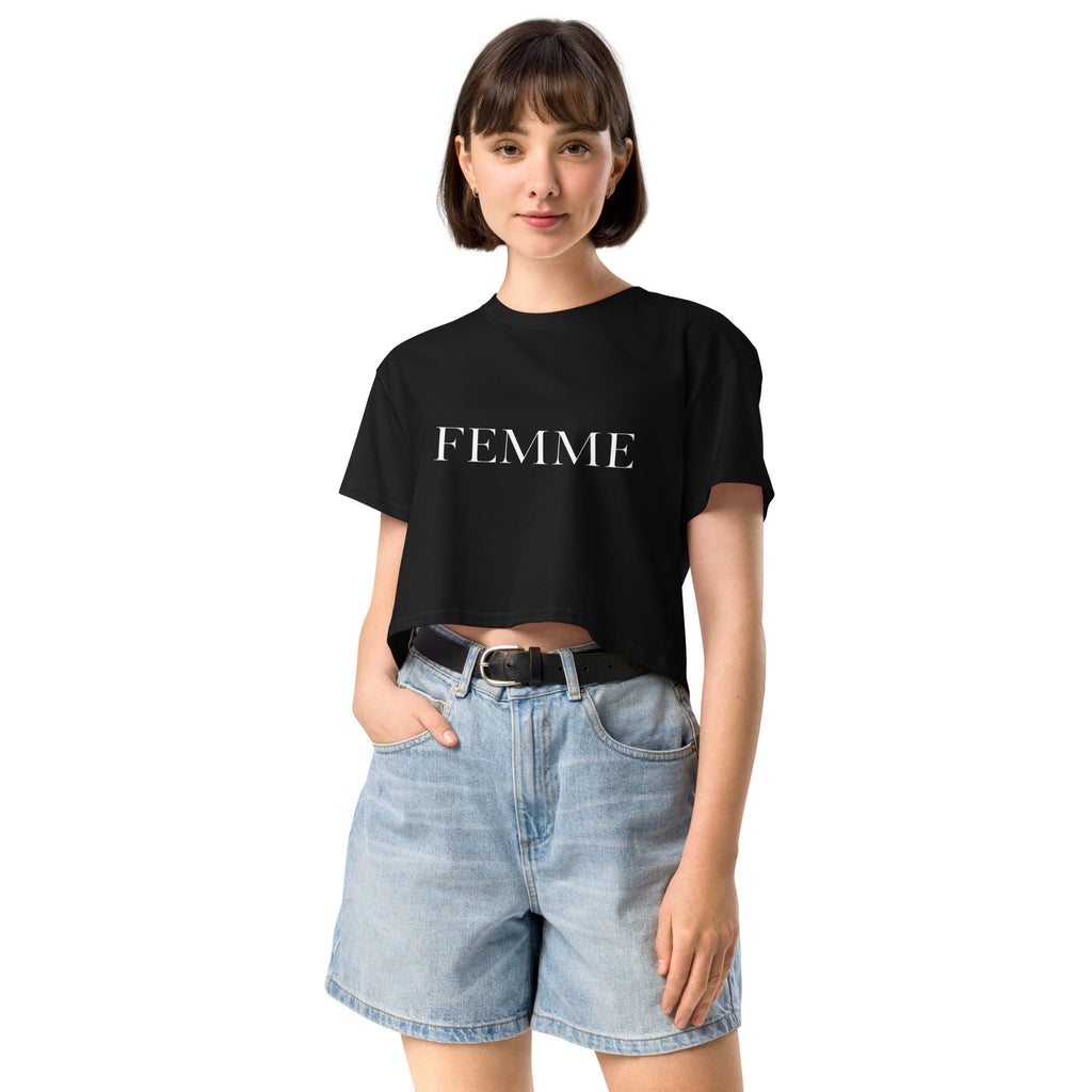 Queer femme model wearing a white FEMME crop top, minimal bold typography