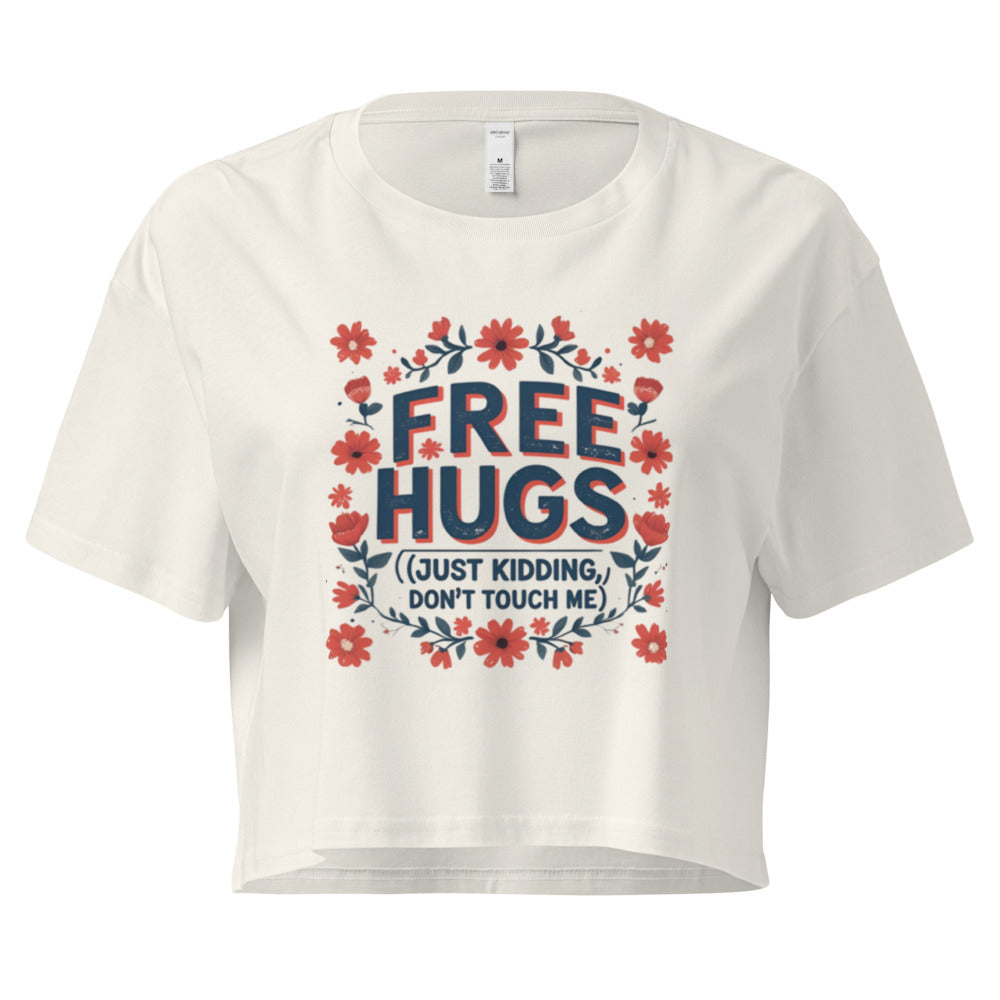 White t-shirt with 'Free Hugs (Just Kidding, Don't Touch Me)' text and floral design on a white background