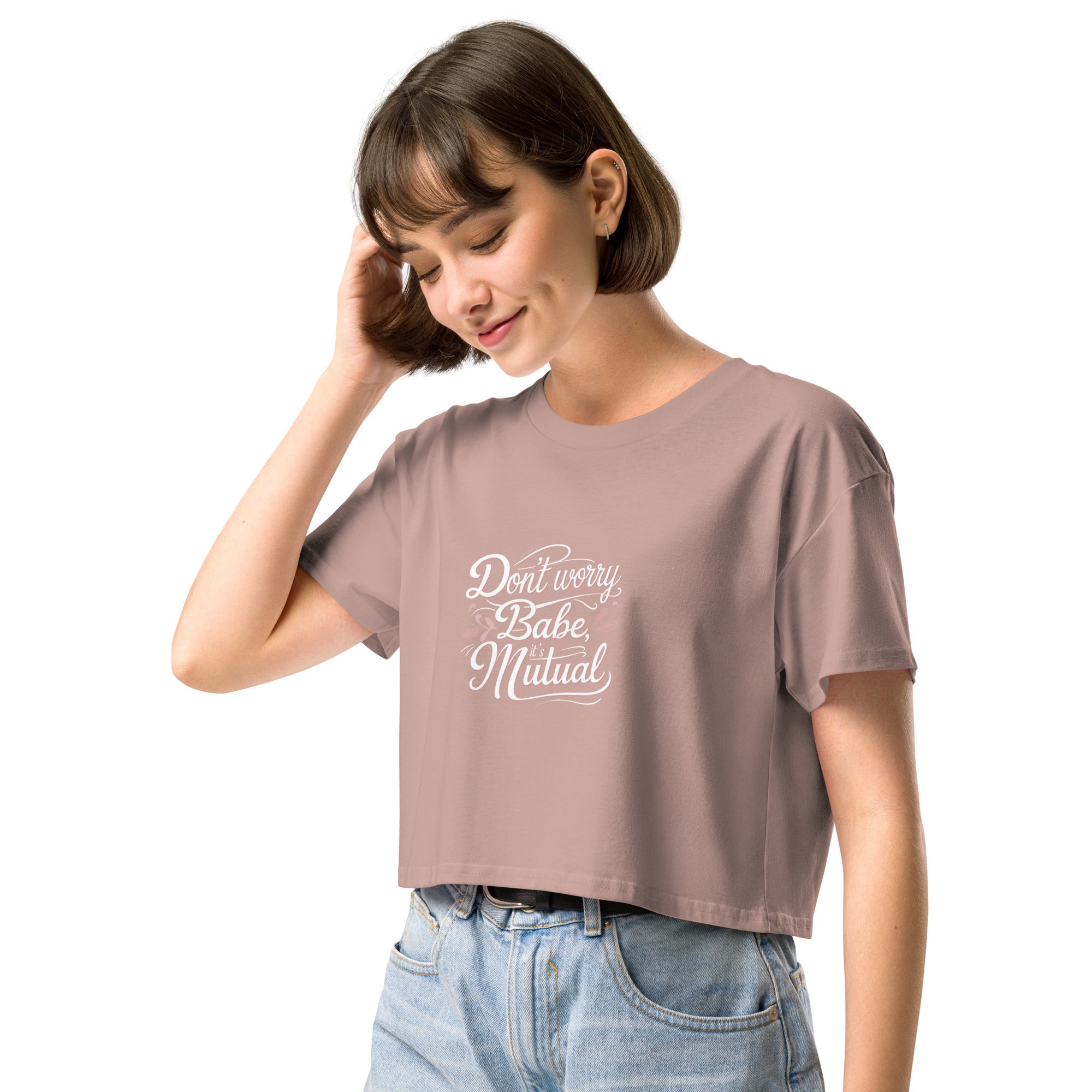 Model wearing Don’t Worry Babe, It’s Mutual cropped slogan T-shirt by Savage Cotton in lilac, styled with shades and a knowing smirk