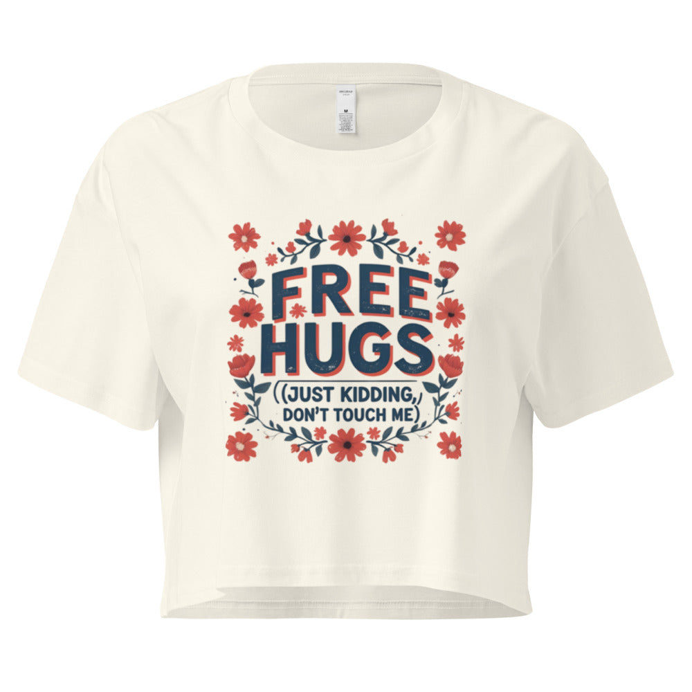 White t-shirt with 'Free Hugs (Just Kidding, Don't Touch Me)' text and floral design on a white background