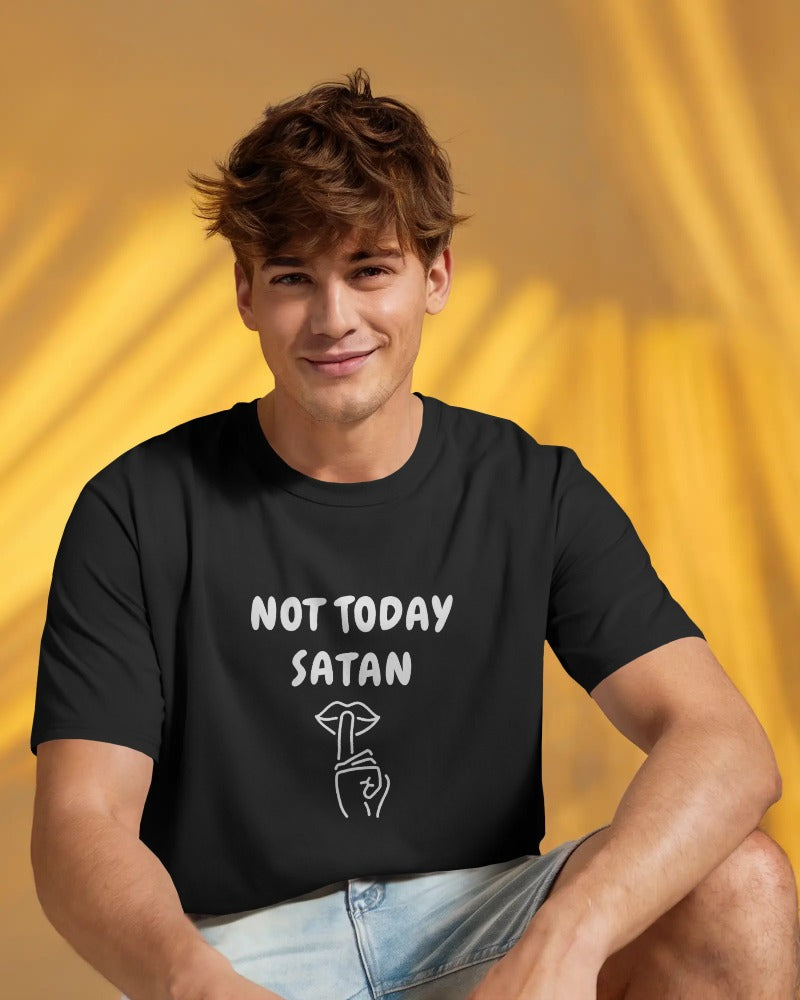 Person wearing a black t-shirt with 'Not Today Satan' text against a yellow background